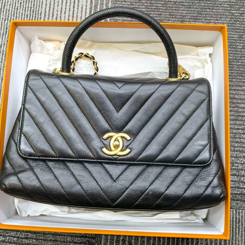 Chanel  Coco Top Handle Bag in Black Quilted Leather